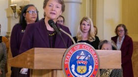 Kim Bimestefer, the executive director of Colorado's Department of Health Care Policy and Financing, speaks at a news conference unveiling a report on prescription drug costs, on Dec. 12, 2019.
