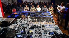 Weapons War: Trinidad and Tobago police exhibit the largest gun seizure in the Caribbean country's history on Oct. 12, 2023, in Santa Cruz, north of the capital, Port of Spain.