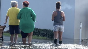 Hollywood residents wade through a king tide