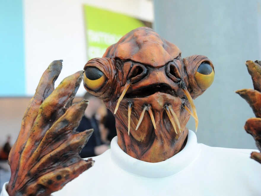 A cosplayer dressed as Admiral Ackbar poses at Disney's 2015 Star Wars Celebration in Anaheim, Calif.