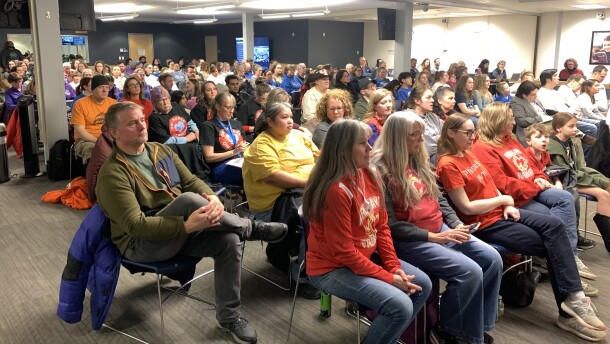 Hundreds of Anchorage community members filled the school board chambers as the body voted on next school yea's budget on Feb. 24, 2026.