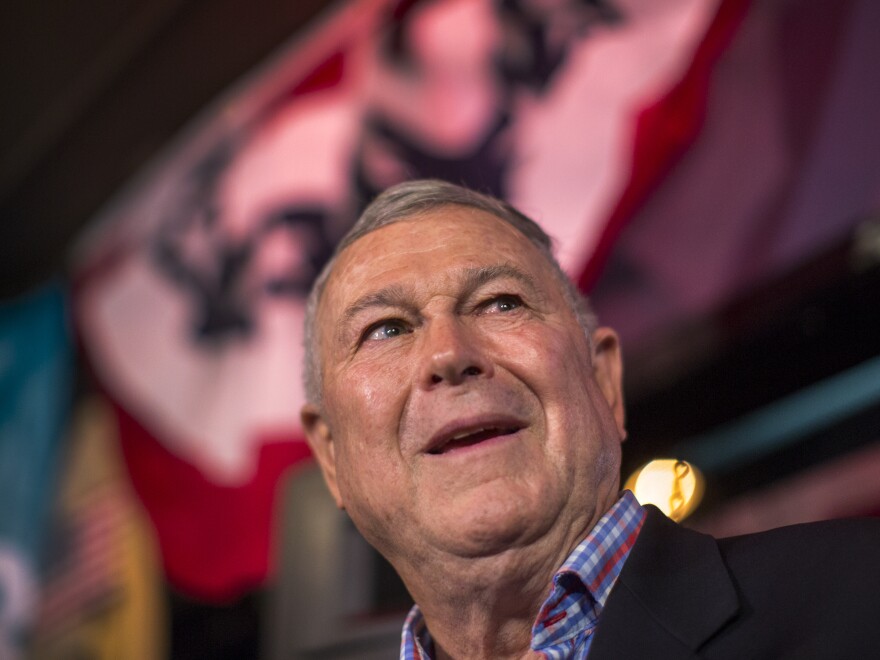 U.S. Rep. Dana Rohrabacher talks to reporters on election night in Costa Mesa, Calif. After days of ballot counting, Democratic challenger Rouda was declared the winner, ending Rohrbacher's nearly three decades-long career in Congress.
