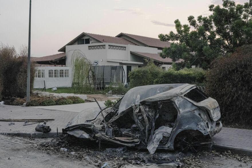 A destroyed car in the village of Be'eri in southern Israel on Oct. 14. The village was attacked by Hamas militants a week prior.
