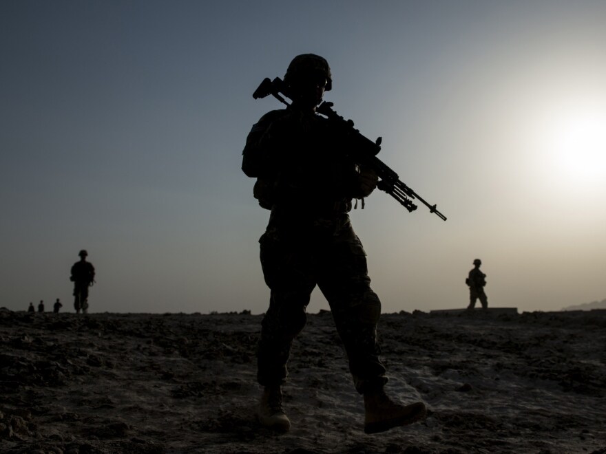 U.S. soldiers patrol near Kandahar airfield in Afghanistan on June 2014. The House Republicans' budget proposal requests less money for defense than the Obama administration's plan, but tries to close some of the gap by adding billions to the Overseas Contingency Operations fund, which has been helping pay for the wars in Afghanistan and Iraq.