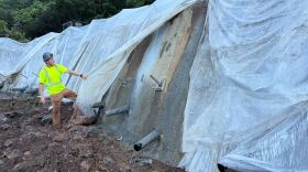 Repair work on the slope under the highway at Waimea Bay after the two Kona low storms in March 2026.