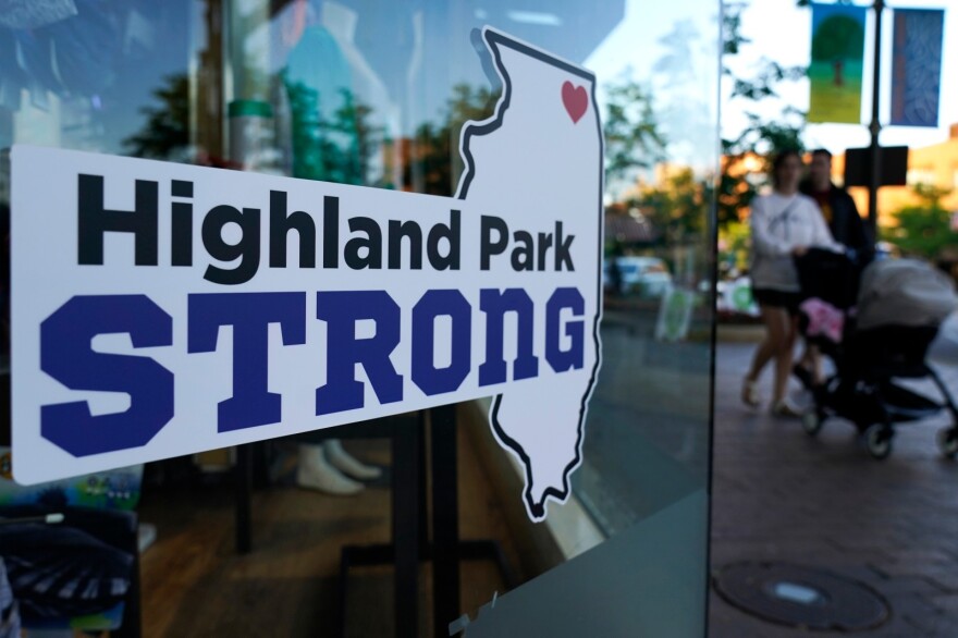 A sign in Highland Park, Ill., Thursday, July 14, 2022. Illinois lawmakers Monday reached a deal on an assault weapons ban that is expected to pass Tuesday that would ban weapons like the one used in the killing of seven people in Highland Park.