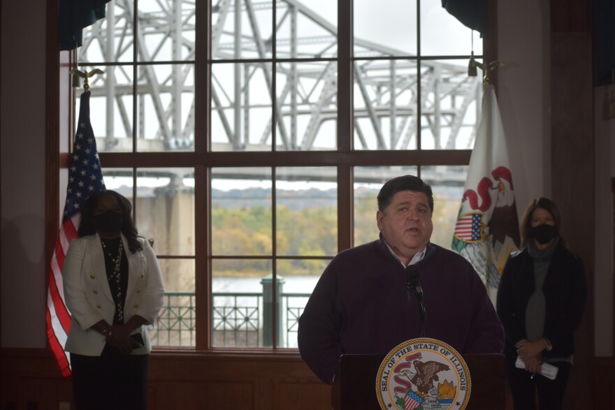 Illinois Gov. JB Pritzker, center, announces the reopening of the Murray Baker Bridge after seven months of rehabilitation at the Gateway Building, Oct. 26, 2020.