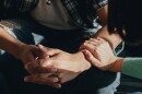 This stock photo depicts a woman offering support to someone.