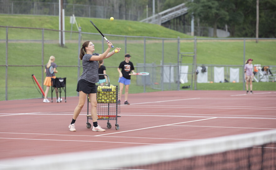Montrose Coach Teri Evans helps her team practice.