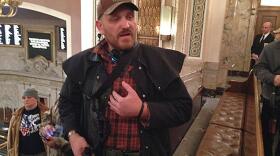Jason McMillan carrying a firearm in the Washington House gallery in 2015. Beginning in January of 2018, all guns will be banned from the Senate gallery. AUSTIN JENKINS/NORTHWEST NEWS NETWORK