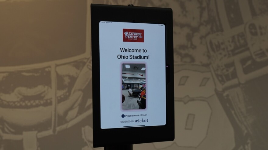 An iPad on a stand with the word "Welcome to Ohio Stadium!" and a digital viewfinder.