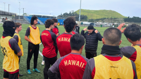 Head coach Ian Andrew Mork talks to the athletes in New Zealand.