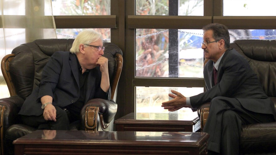 Martin Griffiths, the U.N. special envoy for Yemen, listens to Faisal Amin Abu-Rass, the undersecretary of Houthi rebel government's foreign ministry, upon his arrival at Sana'a International Airport.