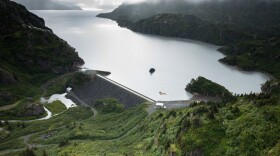A body of water in between mountains.