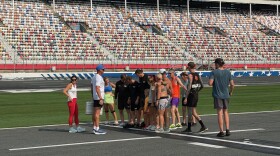 McDonald and community runners prep at the Charlotte Motor Speedway.