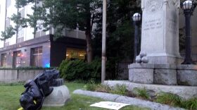A toppled Confederate statue lies on the ground on Monday, Aug. 14, 2017, in Durham, N.C. Activists on Monday evening used a rope to pull down the monument outside a Durham courthouse. The Durham protest was in response to a white nationalist rally held in Charlottesville, Va, over the weekend. (Jonathan Drew/AP)