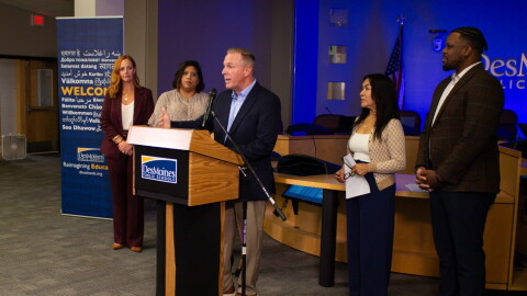 Members of the Des Moines School Board congratulate interim superintendent Matt Smith, who they just named permanent superintendent.