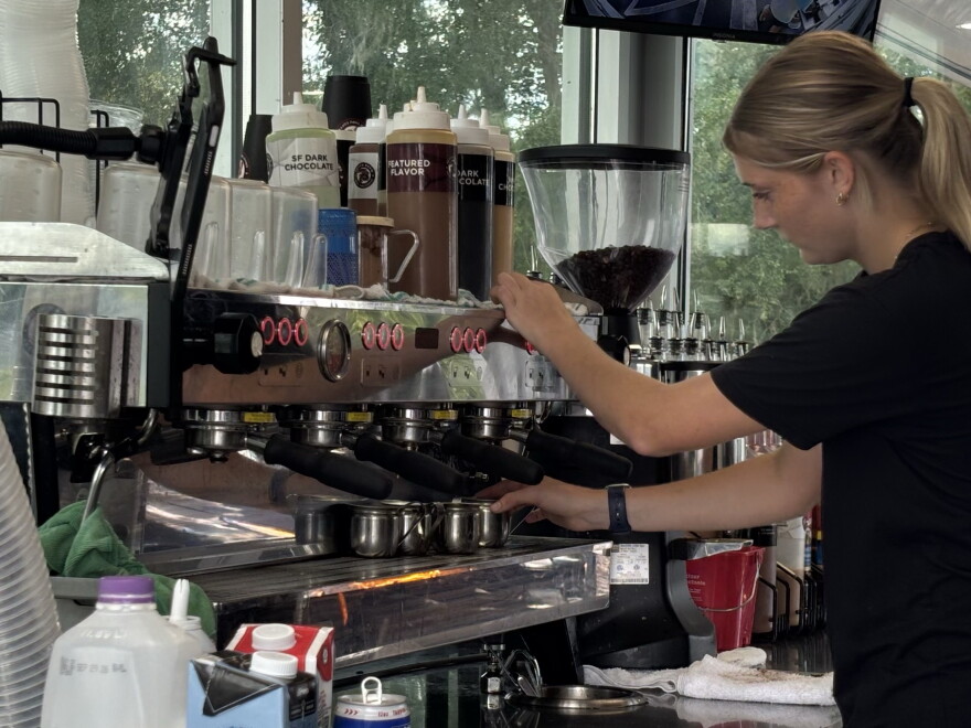 UF student Evelyn Kreger works as a barista at 7 Brew in Gainesville, Florida. Kreger, 19, works while attending UF to help pay for her tuition and housing.