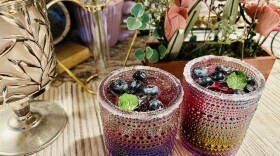 A picture of two glasses of blueberry mocktails.