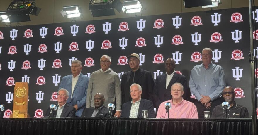 the men who won the 1976 championship pose for a photo