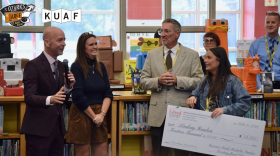 Education Secretary Jacob Oliva (left) addresses a crowd following the announcement of Lindsay Rankin (far right) as the 2027 Arkansas Teacher of the Year. Gov. Sarah Huckabee Sanders and Springdale School District Superintendent Jared Cleveland listen during the surprise ceremony at Bernice Young Elementary School on Oct. 8, 2026.