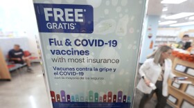 A sign advertises seasonal flu and COVID-19 vaccines at a CVS Pharmacy in Miami, Tuesday, Sept. 9, 2025. (AP Photo/Rebecca Blackwell)