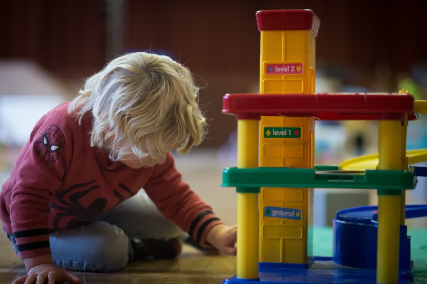 RADSTOCK, UNITED KINGDOM - JANUARY 06:  A young boy plays with toys at a playgroup for pre-school aged children in Chilcompton near Radstock on January 6, 2015 in Somerset, England. Along with the health and the economy, education and childcare are to be key issues in the forthcoming election.  (Photo by Matt Cardy/Getty Images)