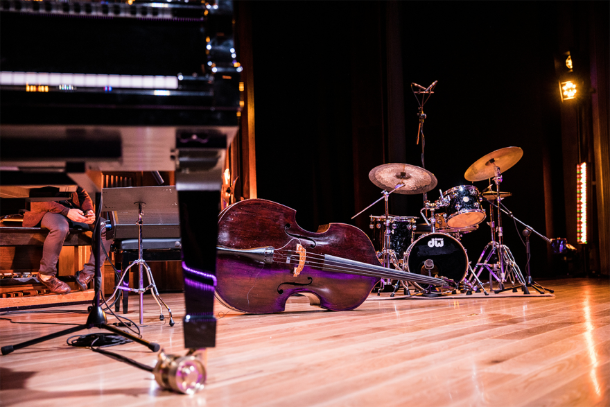 The instruments of a jazz band are set up on a stage. 