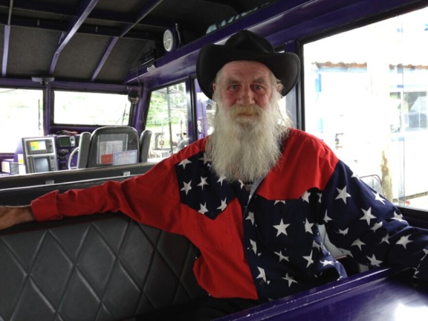 Lawrence Dupler, known as Captain Larry, is listed on the company’s website as captain with Orca Enterprises. In this photo taken July 2013, Dupler is on board the Orca Odysea. (Photo by Lisa Phu, KTOO - Juneau)