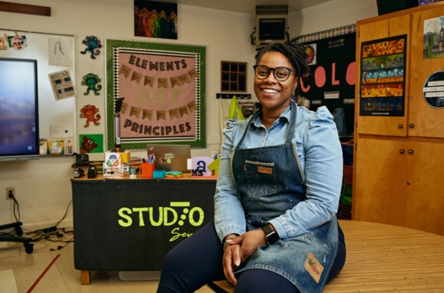 Ashley R Thompson (aka Ms. Art) poses for a portrait in her classroom at Howard Hall Elementary in Fayetteville, NC. She is one of hundreds of teachers who struggles with testing anxiety who will benefit from a new law that allows her to renew her teaching license without passing a standardized exam. (Courtesy - Matt Ramey, WUNC)