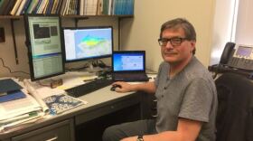 Permafrost researcher Vladimir Romanovsky, pictured in his office at the University of Alaska Fairbanks in April, 2018. On his computer screen is a new map he helped develop showing permafrost scenarios out to 2090. (Ravenna Koenig/ Alaska’s Energy Desk)