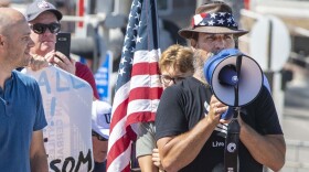 Alan Hostetter, seen here in May 2020, became a leading activist against coronavirus-related lockdown policies in Orange County, Calif. Hostetter, a former police chief and yoga instructor, was convicted of conspiring to obstruct congress' certification of the 2020 presidential election results at the Jan. 6, 2021, riot at the U.S. Capitol.