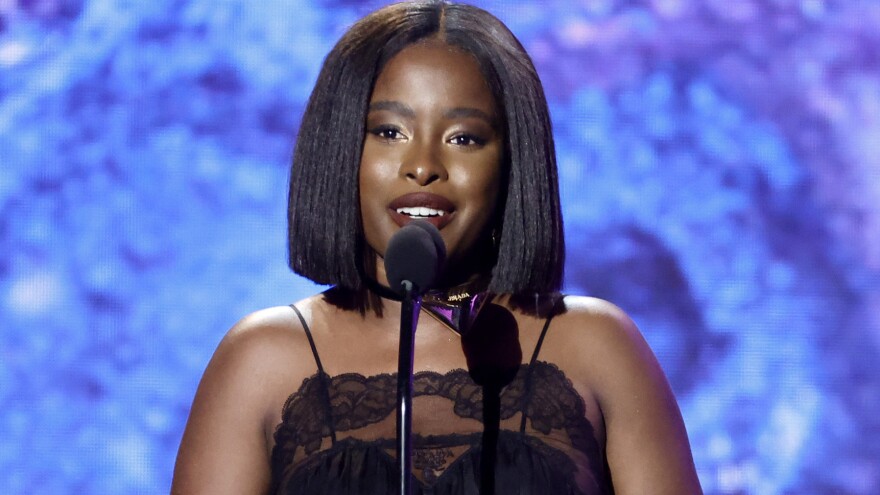 Amanda Gorman says she wrote "The Hill We Climb" — which she read at President Biden's inauguration — "so that all young people could see themselves in a historical moment." Gorman is seen here in February, at the Grammy Awards.