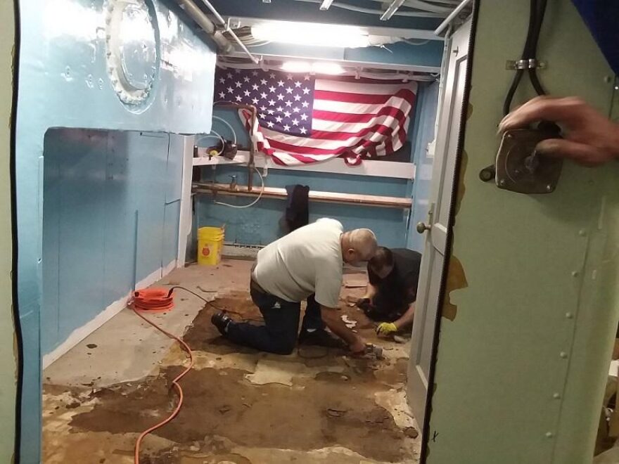 Work was underway below deck, removing and replacing a floor in a section of the decommissioned U.S.S. Little Rock, during an effort to carry out maintenance and repair work, in advance of the summer tourist months at the Buffalo and Erie County Naval and Military Park. Credit Michael Mroziak, WBFO