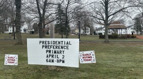 Signs dot the town green in Colchester, Conn., on Wednesday, March 27, 2024, reminding voters they can vote early in the state's presidential primary. It marks the first time voters can vote early and in-person in Connecticut.
