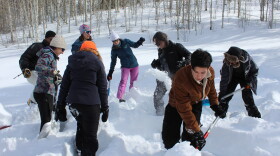 Students in the inaugural “Youth in Nature” internship program build an igloo-like shelter called a “quinzee” on a recent Saturday in February up near Ashcroft. 