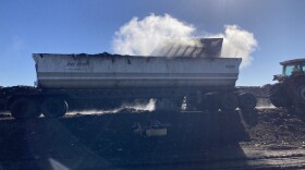 A bulldozer loads compost into a truck at Recology's Blossom Valley Organics composting facility in Vernalis, CA on December 2nd 2022