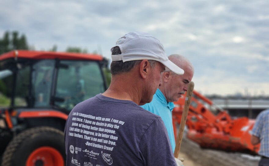 MI Shores volunteer Dennis Werblow shovels debris out of the shores on Blair Street Pier in Alpena on Wednesday, July 29, 2026.