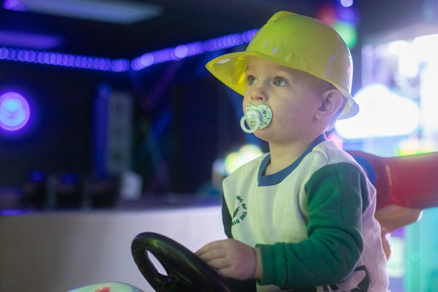 Benjamin Miller plays on a racing game in Play & Party Co.'s gaming room. The gaming room, main room and glam room can all be rented out for parties.