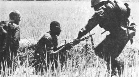 Black and white Marines served side by side during the Vietnam War, as seen in this 1966 photo of a firefight with the Viet Cong. But racial tension was not uncommon throughout the armed services.