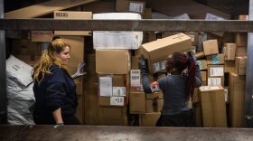 Workers sort packages at a FedEx global hub, one of only seven in the U.S., on Dec. 16, 2014, in Newark, N.J. (Andrew Burton/Getty Images)
