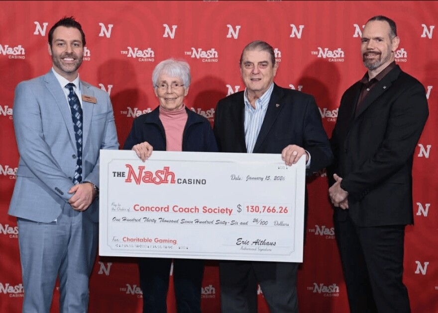 George Roberts, second from right, accepting a check from the Nash in January with his wife Margaret Roberts, Nash Assistant General Manager Nash Assistant General Manager Aaron Feinberg, left, and Director of Security Robert Page, right.