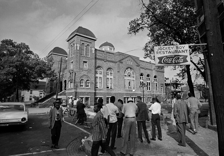 A state trooper and two plainclothes men stand guard at a roadblock at the 16th Street Baptist Church in Birmingham, Ala., a day after the bombing on Sept. 16, 1963.