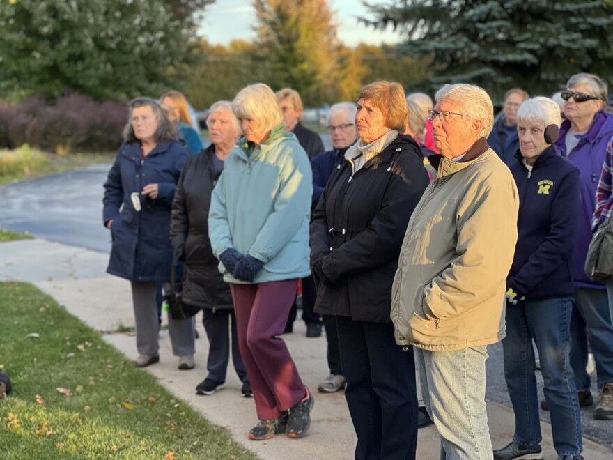 A crowd gathers outside the Cheboygan Hospice House in October to commemorate the building after it was closed by McLaren Health System due to funding and staffing challenges.