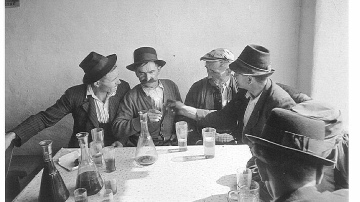 A few characters sitting at a table.