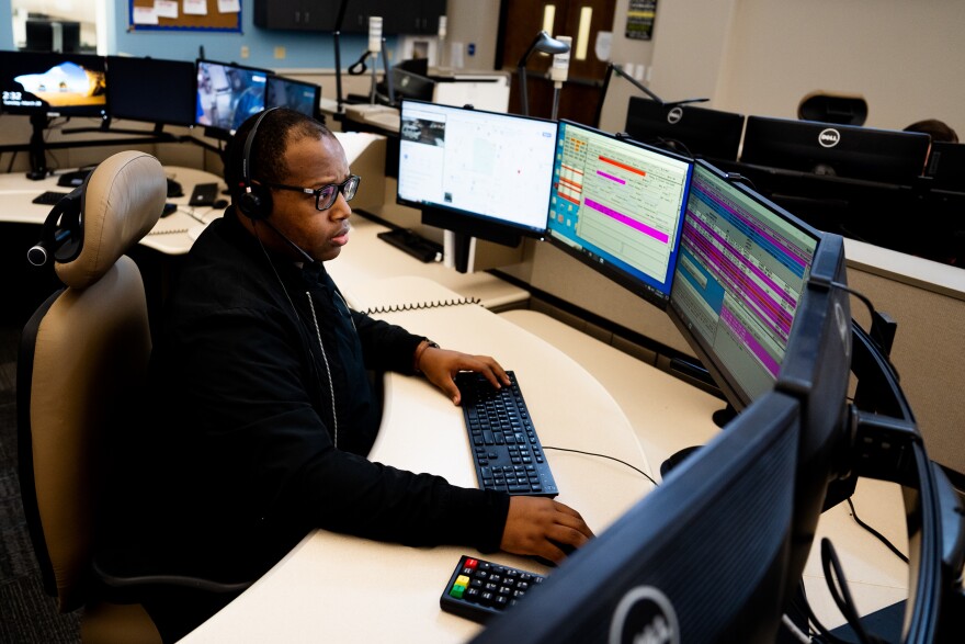 Andre Parker, a St. Louis County Public Safety Dispatcher, takes a call on Tuesday, March 28, 2023, at the St. Louis County Chief William Karabas Emergency Communications Building in Ballwin.