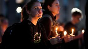 Community members gather during a candlelight vigil for Sgt. Declan Coady, 20, of West Des Moines, Iowa, who died when a drone hit a command center in Port Shuaiba, Kuwait, during the Iran Israel U.S. war, Monday, March 9, 2026, at Drake University in Des Moines, Iowa. (Charlie Neibergall/AP)