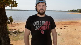 Damien O’Daniel pauses for a photo at a park in Shawnee. O’Daniel received a third-degree burn in an industrial accident at a Logan County marijuana processing plant.