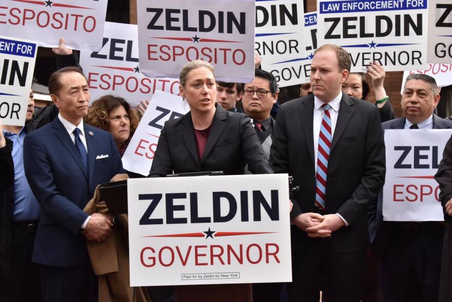 Republican Lee Zeldin, at right, is the leading GOP candidate for governor ahead of Monday's State GOP convention. Zeldin's running mate is NYPD veteran Amanda Esposito (center)