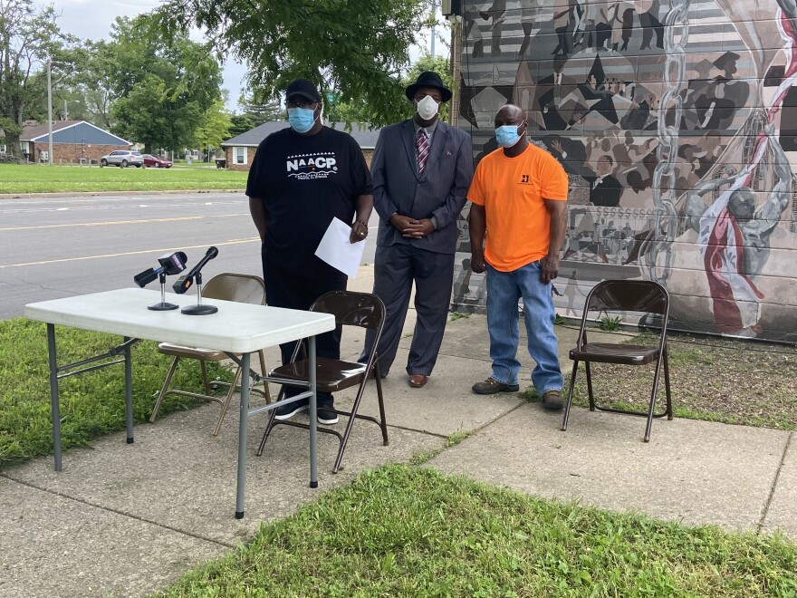 Peoria NAACP President Marvin Hightower (left) led leaders in calling for an end to theft and destruction of property as a means of protesting the killing of George Floyd.